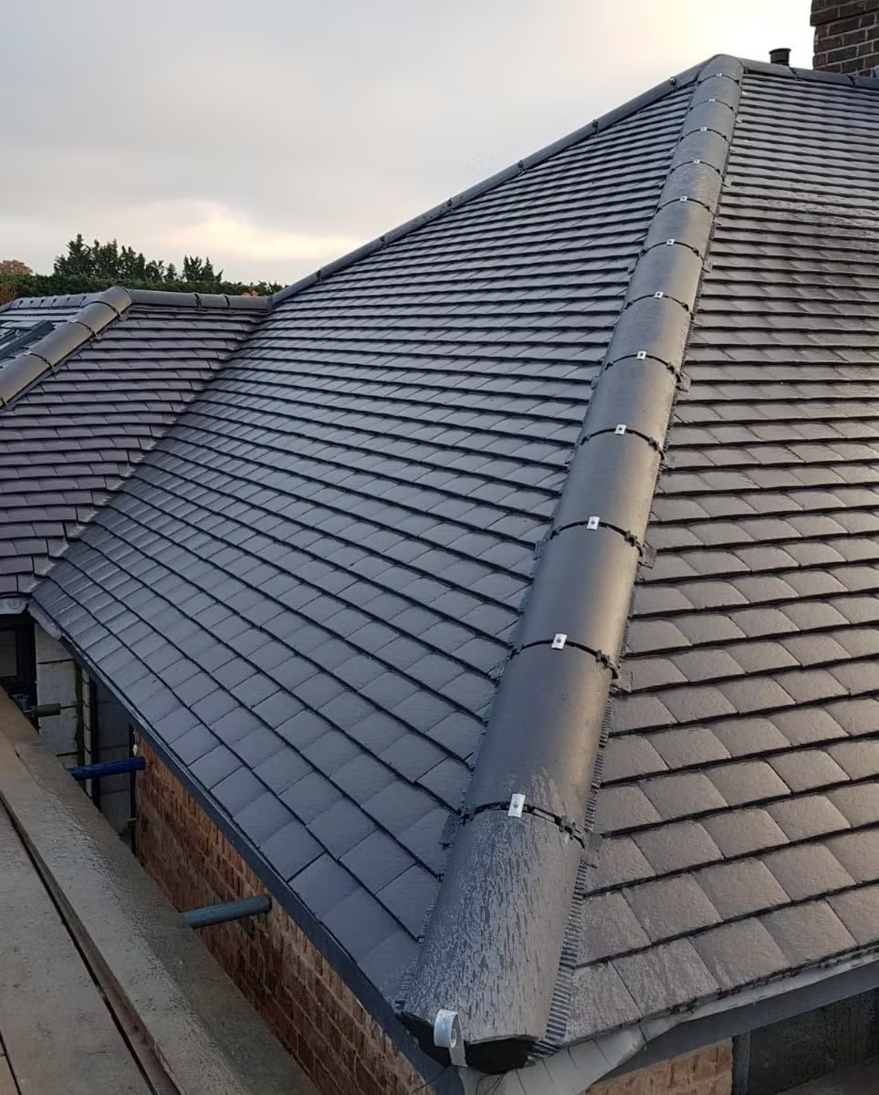 A finished tiled roof with a new dry-fixed ridge by Creative Roofing